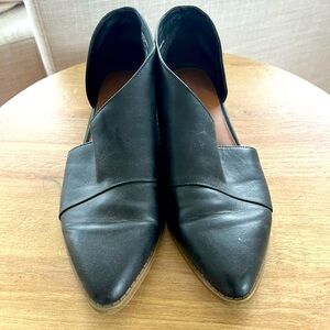 Black leather pointed toe flats with ankle cut out